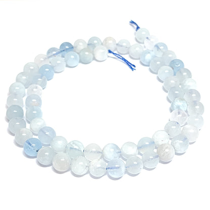 Beaded necklace with white and blue stones on a white background